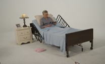 Home hospital bed pictured on Reeves Medical’s full-electric bed rental listing